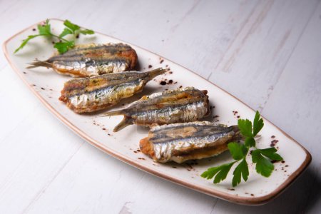 Fried stuffed anchovies. Traditional tapa from the city of Malaga in Spain.