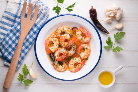 Photo for Traditional Spanish tapa of gambas al ajillo. Prawns cooked with olive oil and garlic. - Royalty Free Image