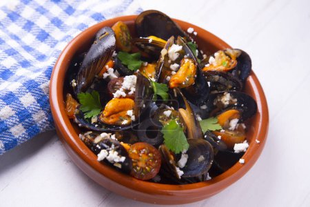 Photo for Traditional Spanish tapa of steamed mussels with cheese - Royalty Free Image