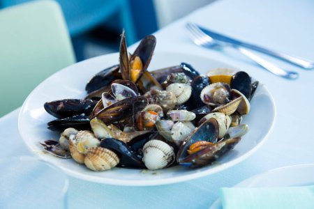 Photo for Traditional Spanish tapa of steamed mussels and other seafood. - Royalty Free Image
