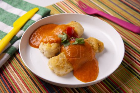 Photo for Hake battered with tomato sauce. Traditional Spanish recipe. - Royalty Free Image