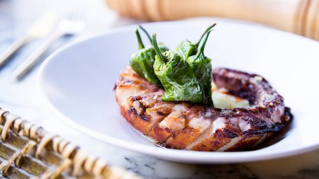 Photo for Grilled octopus with potatoes and padrn peppers. Traditional northern Spanish recipe. - Royalty Free Image