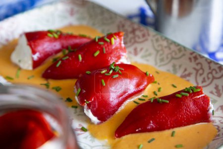 Piquillo peppers stuffed with cream cheese and cod. Traditional Spanish tapa.