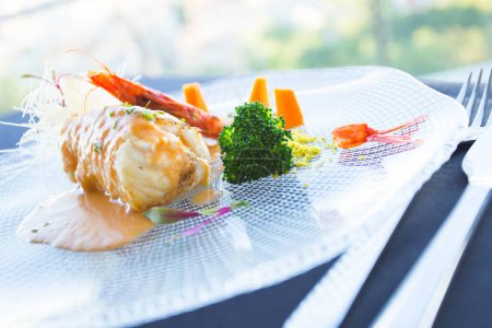 Photo for Baked monkfish with potatoes and vegetables. - Royalty Free Image