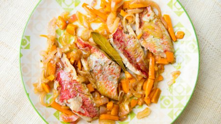 Photo for Pickled red mullet with carrot and onion. - Royalty Free Image