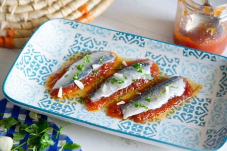 Photo for Marinated sardines served over tomato jam. - Royalty Free Image