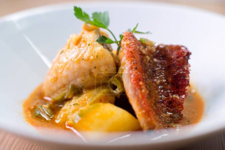 Photo for Grilled red mullet tapa with artichokes and peas. - Royalty Free Image