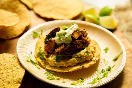 Photo for Tostada with baked pumpkin, name given to various dishes in Mexico that include a toasted tortilla as the main base of its preparation. - Royalty Free Image