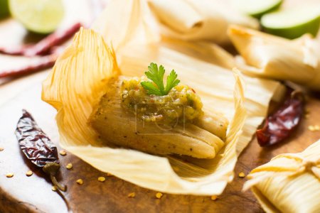 A tamale, in Spanish tamal, is a traditional Mesoamerican dish made of masa, a dough made from nixtamalized corn, which is steamed in a banana or corn leaf.