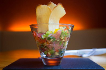 Photo for Ceviche is a small traditional Latin American appetizer consisting of pieces of raw seafood or fish in an acidic marinade. - Royalty Free Image