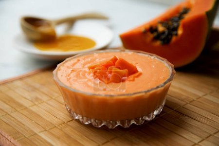 Photo for Yogurt with papaya and honey in a Latin American restaurant. - Royalty Free Image