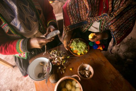 Photo for Cooking a traditional Andean vegetable soup before a Pachamanca feast with a Quechua tribe in the Sacred Valley, Peru. - Royalty Free Image