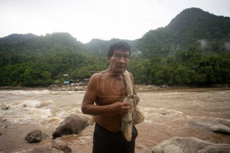 Photo for Chazuta, Peru; 1st October 2022: Fisherman working in the peruvian jungle river Huallaga - Royalty Free Image