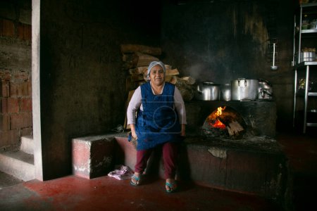 Photo for Chazuta, Peru; 1st October 2022: A woman in the kitchen of a Peruvian restaurant in the Amazon Jungle. - Royalty Free Image