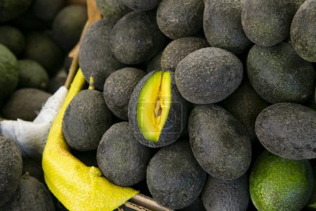 Photo for Avocados at a stall in the central fruit and vegetable market in Arequipa, Peru. - Royalty Free Image