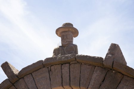 Photo for Stone heads carved into the arches on the island of Taquile on Lake Titicaca in Peru. - Royalty Free Image