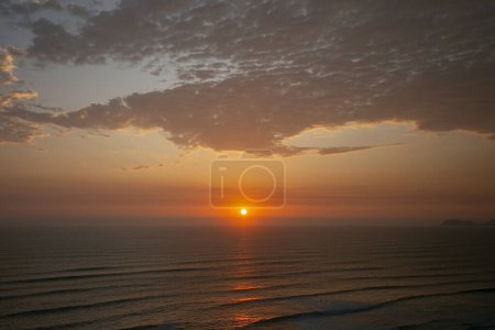 Photo for Sunset at sea seen from the Miraflores neighborhood in the city of Lima in Peru. - Royalty Free Image