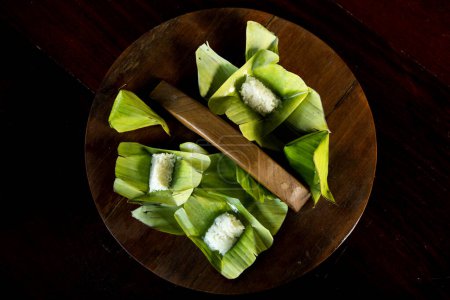 Photo for Khao Nom Nap - Sticky Rice Coconut Dumpling. These sweet treats are made of sticky rice and coconut - Royalty Free Image