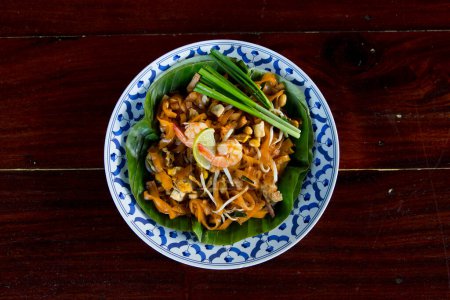 Photo for Street food stall cooking Pad Thai in Bangkok, Thailand. - Royalty Free Image