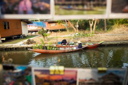 Photo for Amphawa, Thailand; 1st January 2023: Women selling food in their canoes in a floating market in Amphawa district. - Royalty Free Image