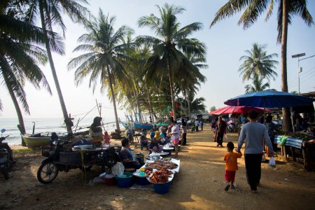 Photo for Sichon, Thailand; 1st January 2023: Sellers and buyers at the fish market on Sichon beach. - Royalty Free Image