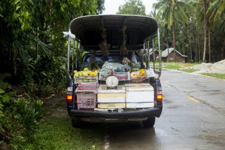 Photo for Ko Yao, Thailand; January 1, 2023: Van with food products to sell in the middle of a road. - Royalty Free Image