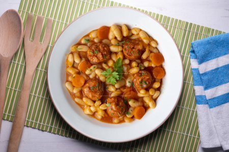 Photo for White bean stew with chorizo. Traditional dish of Spanish gastronomy from the Asturias region in the north of the country. - Royalty Free Image
