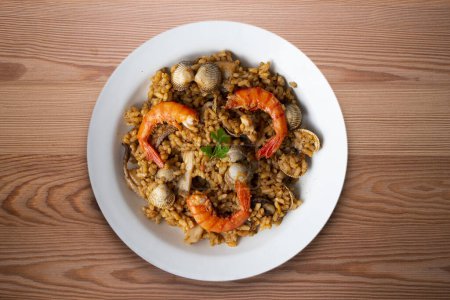 Photo for Spanish seafood paella with red shrimp and clams. - Royalty Free Image