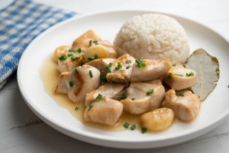 Photo for Garlic chicken. Chicken tapa cooked with garlic sauce and served with white rice. - Royalty Free Image