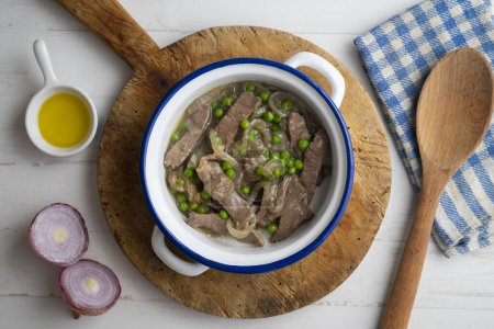 Photo for Beef strips cooked with onion and peas. - Royalty Free Image