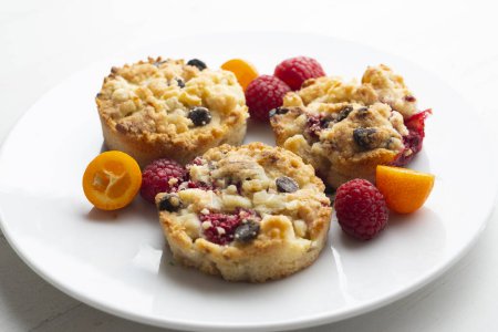 Photo for Individual crumbles filled with fruit and chocolate chips. - Royalty Free Image