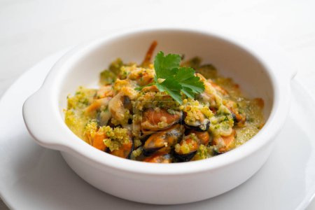 Photo for Mussels gratin. Gratin seafood dish with bread and parsley. - Royalty Free Image