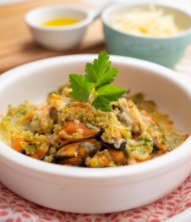 Photo for Mussels gratin. Gratin seafood dish with bread and parsley. - Royalty Free Image
