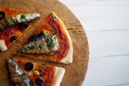 Photo for Neapolitan pizza with tomato and sardines. - Royalty Free Image