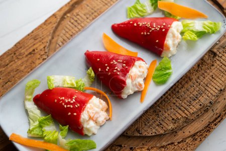 Photo for Piquillo peppers stuffed with mayonnaise and prawns. Traditional Spanish tapa. - Royalty Free Image