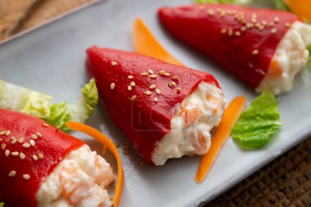 Photo for Piquillo peppers stuffed with mayonnaise and prawns. Traditional Spanish tapa. - Royalty Free Image