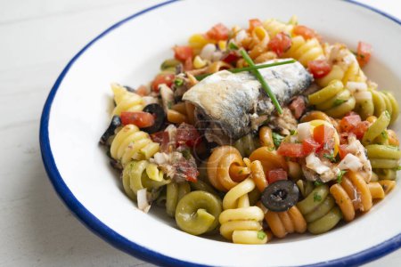 Photo for Fresh pasta with vegetables and sardines. - Royalty Free Image