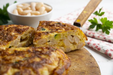 Photo for Spanish potato omelette made with white beans and zucchini. - Royalty Free Image
