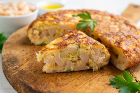 Photo for Spanish potato omelette made with white beans and zucchini. - Royalty Free Image
