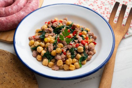 Photo for Chickpea salad with spinach, minced pork and red pepper. - Royalty Free Image