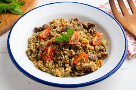 Photo for Couscous with vegetables and beef marinated with fresh mint. - Royalty Free Image