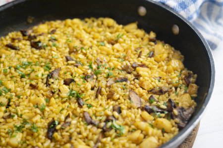 Photo for Rice paella with fish and cuttlefish, traditional Spanish recipe. - Royalty Free Image