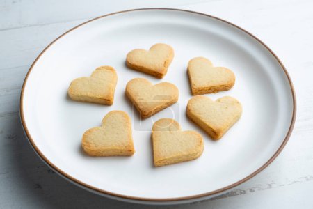 Photo for Preparing butter cookies for children with star and heart shapes. - Royalty Free Image