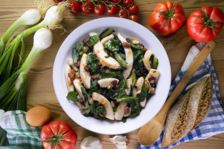 Photo for Cuttlefish cooked with chard and spinach. Spanish traditional tapas. - Royalty Free Image