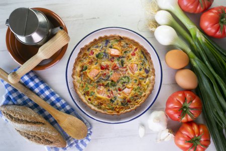 Photo for Traditional salmon quiche with broccoli and vegetables - Royalty Free Image
