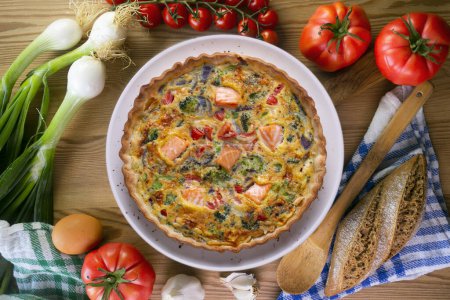 Photo for Traditional salmon quiche with broccoli and vegetables - Royalty Free Image