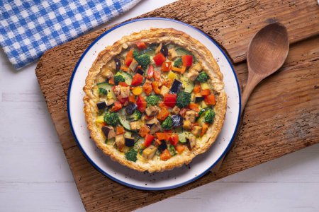 Photo for Veggie quiche traditional french recipe on puff pastry. - Royalty Free Image