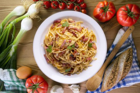 Photo for Carbonara pasta. Carbonara is an Italian pasta dish from Rome made with eggs, hard cheese, cured pork, and black pepper. - Royalty Free Image