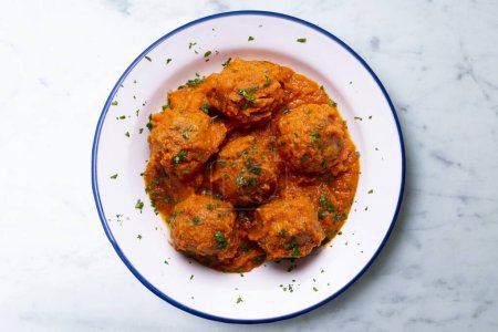 Photo for Meat meatballs with tomato sauce and vegetables. Traditional Spanish tapa recipe. - Royalty Free Image
