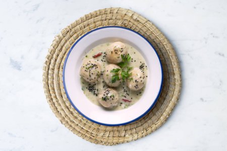 Photo for Fish meatballs with white wine sauce. Traditional tapas from Barcelona, Spain. - Royalty Free Image